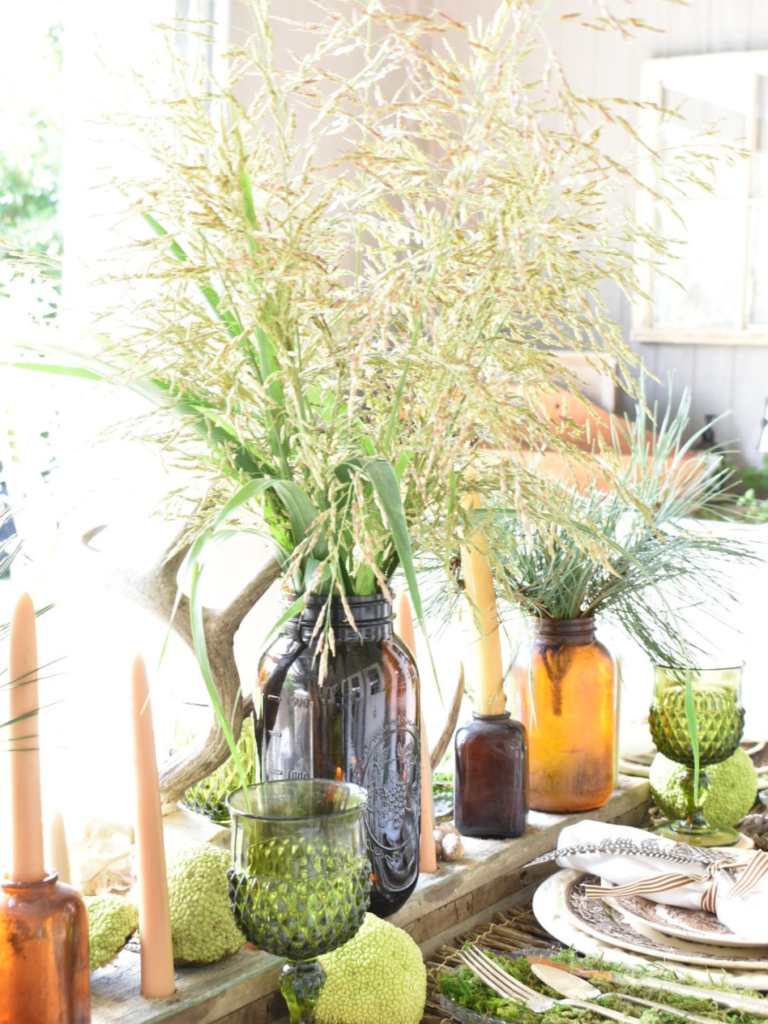 tall grasses in brown vase for woodsy table centerpiece