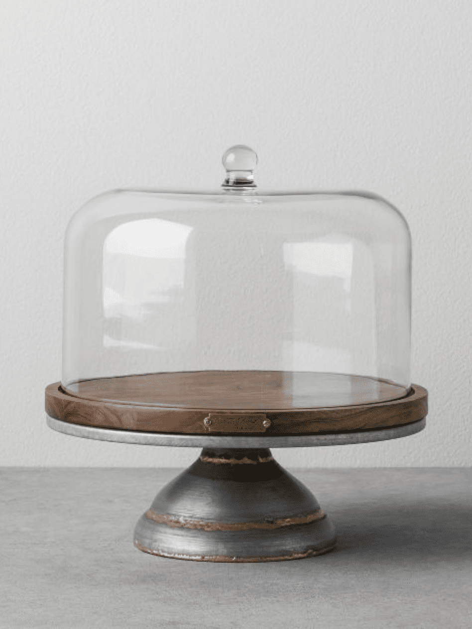 wood and metal cake stand with clear glass dome