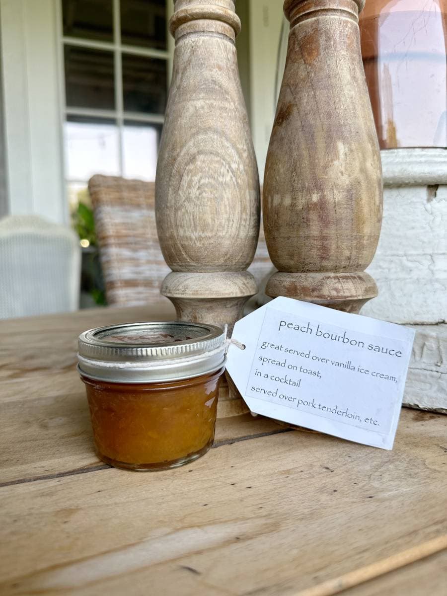 small mason jar of peach bourbon sauce