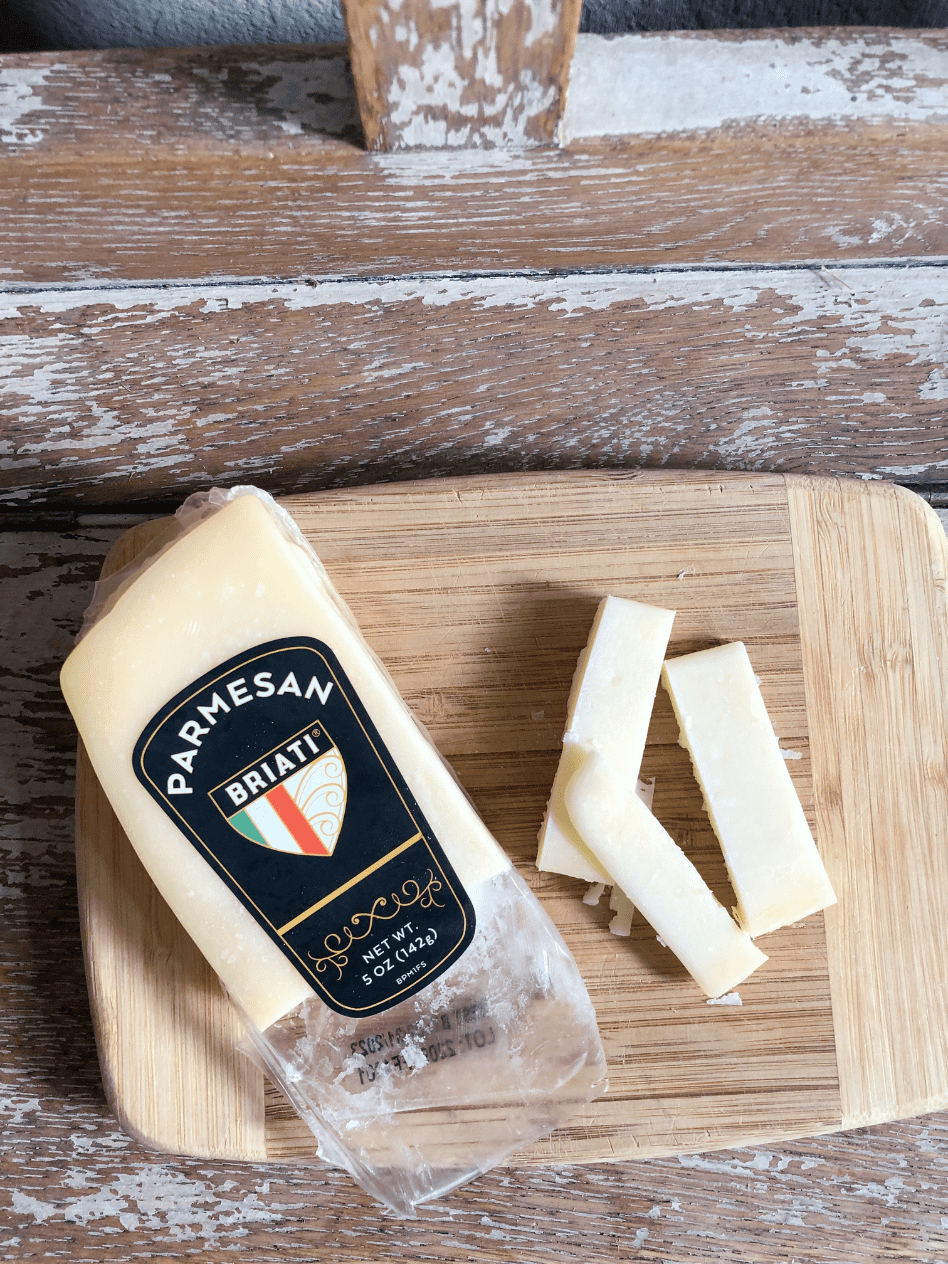 overhead view of parmesan cheese on cutting board