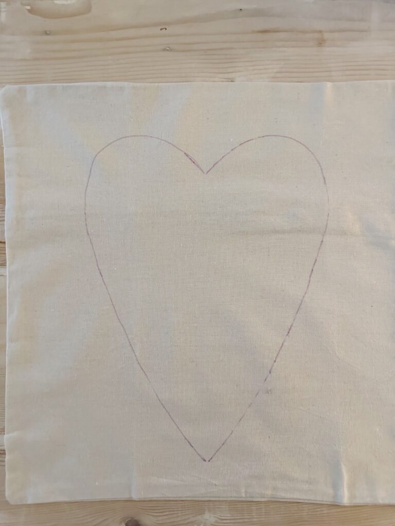 heart shape drawn on linen pillow cover