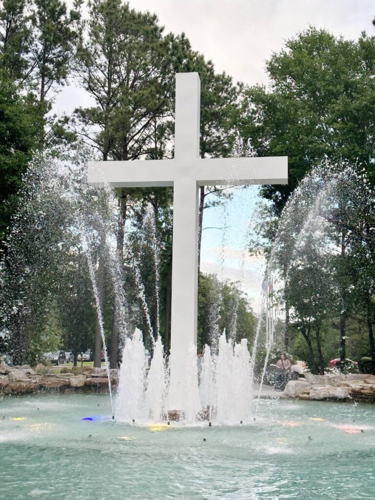 white cross in water fountain