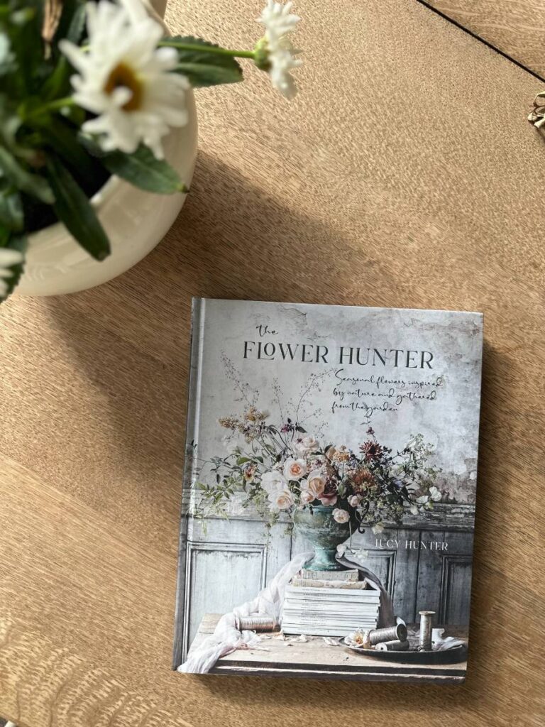 flower hunter book sitting on side table