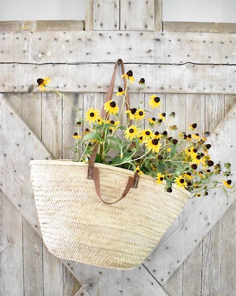 market tote with black eyed susans hanging on barn door