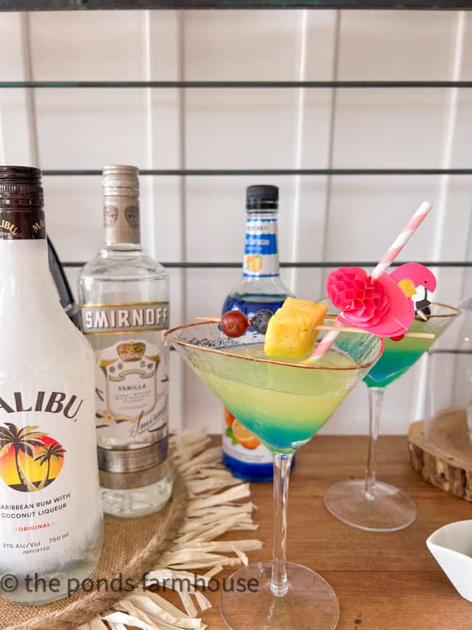 colorful pina colada martini with umbrella in drink