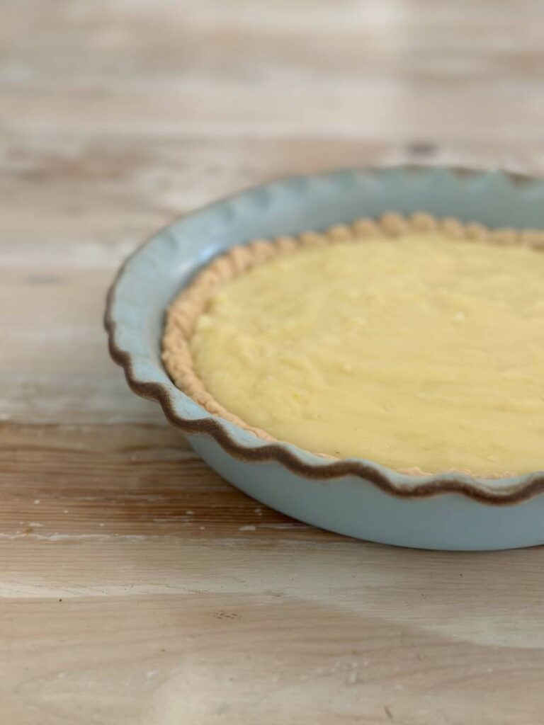 whole cream pie filling in blue pie plate