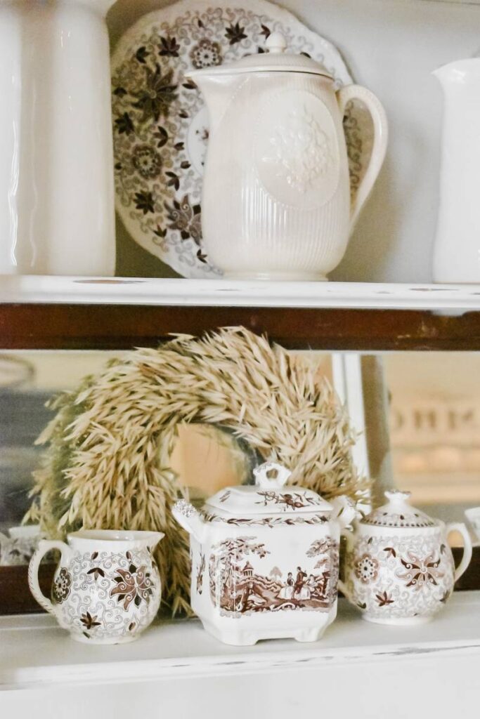 brown transferware and wheat wreath in china hutch