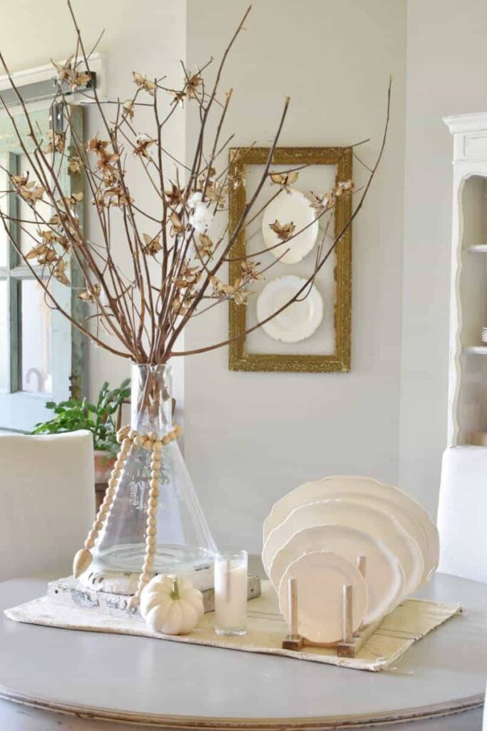 peach blossoms in vase on breakfast table