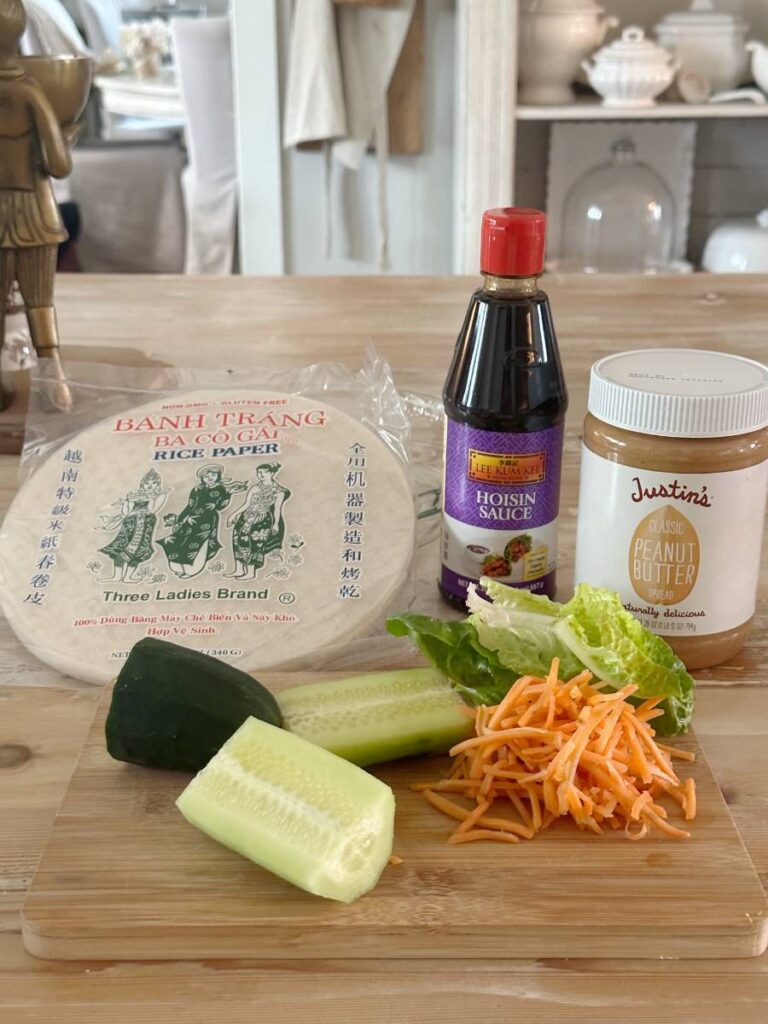 ingredients for spring rolls rice paper soy sauce carrots cucumbers lettuce peanut butter hoisin sauce