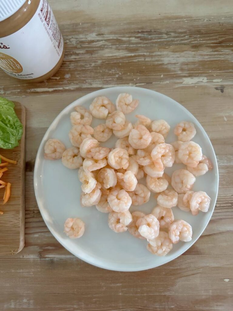 white plate of steamed shrimp