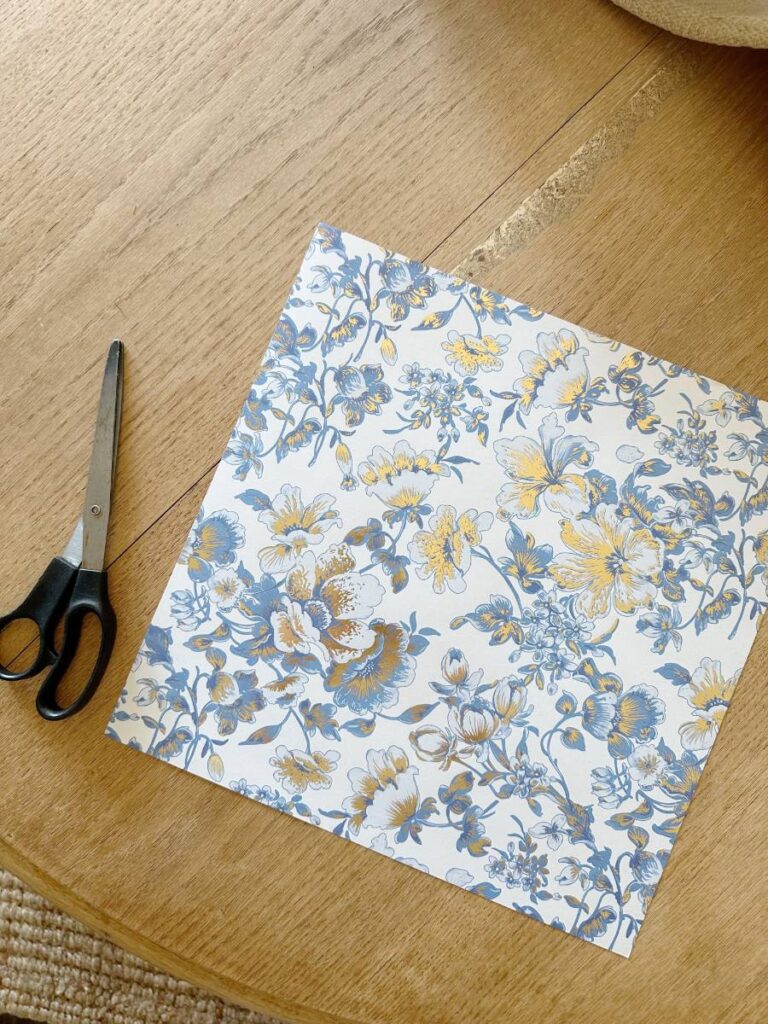 blue floral paper and scissors for making paper lantern