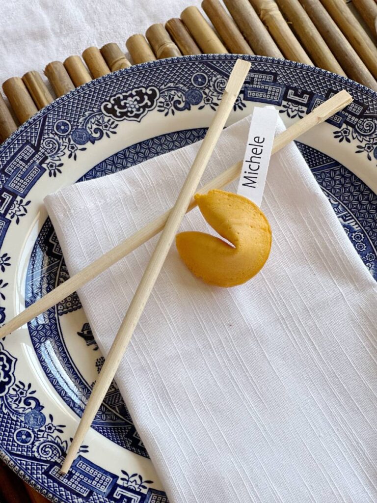 chinese themed place setting bamboo placemat blue asian dinner plate white napkin with chinese symbol chopsticks fortune cookie for place card