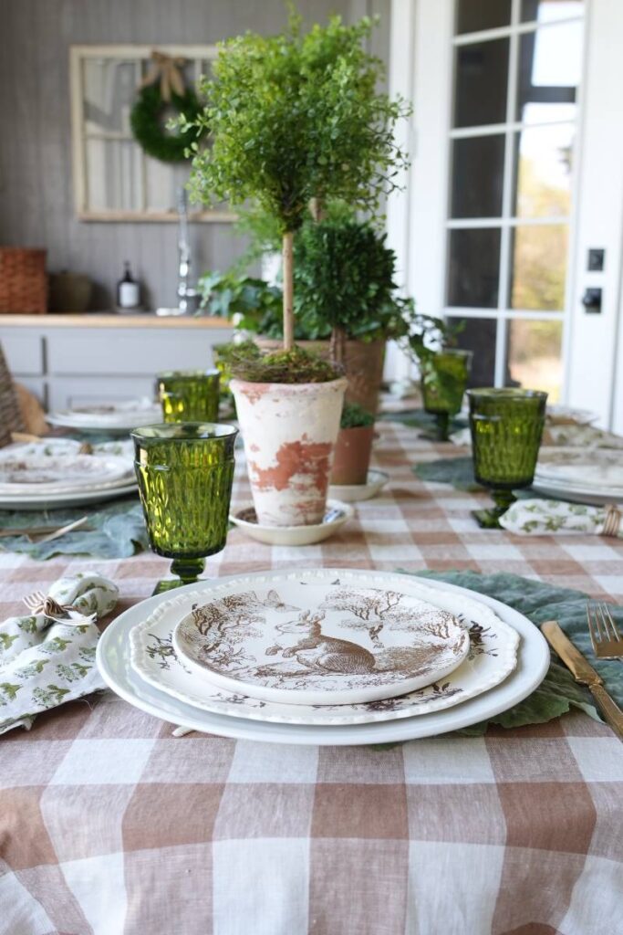 brown pattern bunny plate green block print napkin gold flatware on cabbage leaf placemat for spring place setting