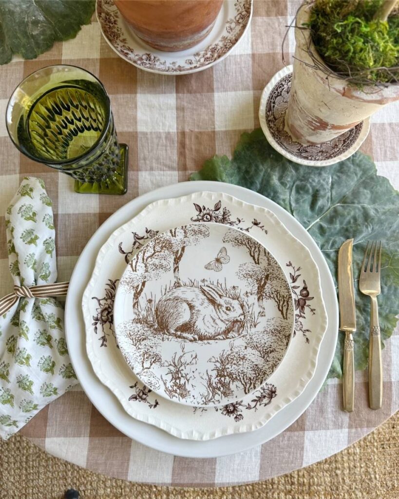 brown pattern bunny plate green block print napkin gold flatware on cabbage leaf placemat for spring place setting