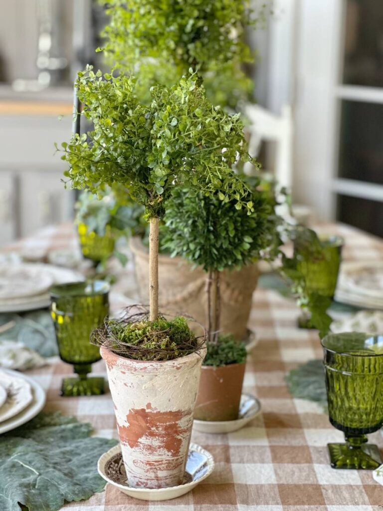 faux topiary in aged terra cotta pot for spring table centerpiece