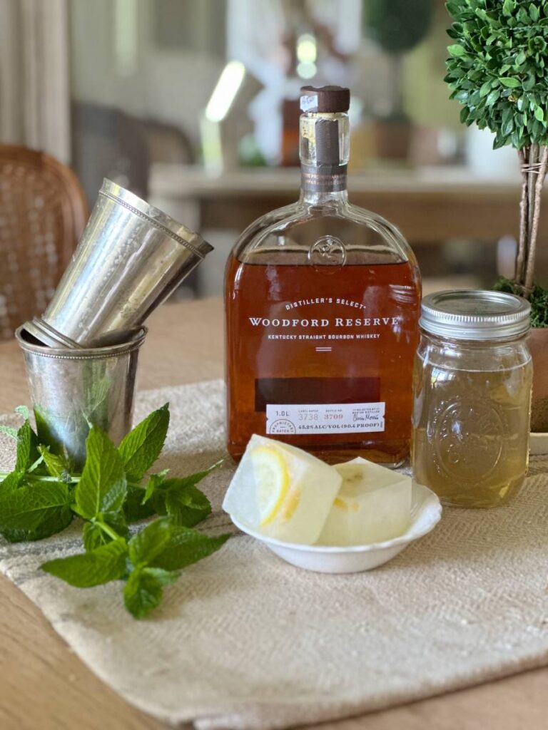 Ingredients for mint julep kentucky bourbon mint simple syrup lemonade ice cubes julep cup