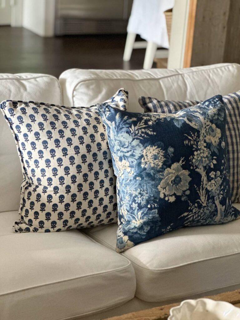 blue and white throw pillows on white sofa