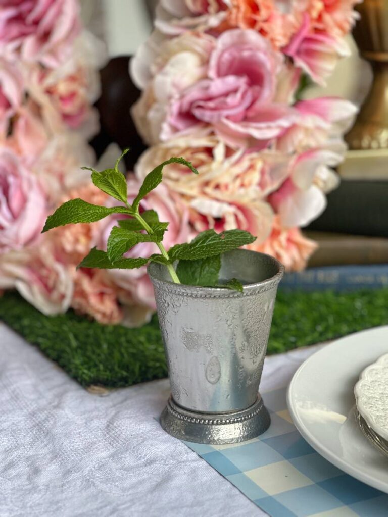 silver mint julep cup with fresh mint sprig