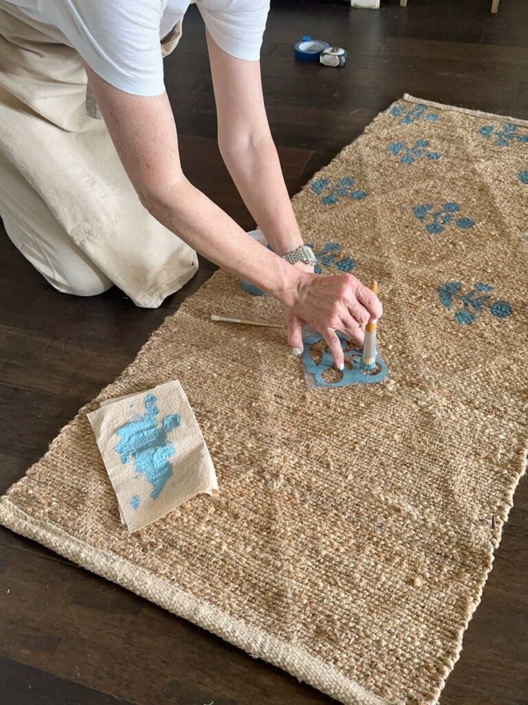 process of DIY block print jute rug blue paint block print stencil pattern stencil brush