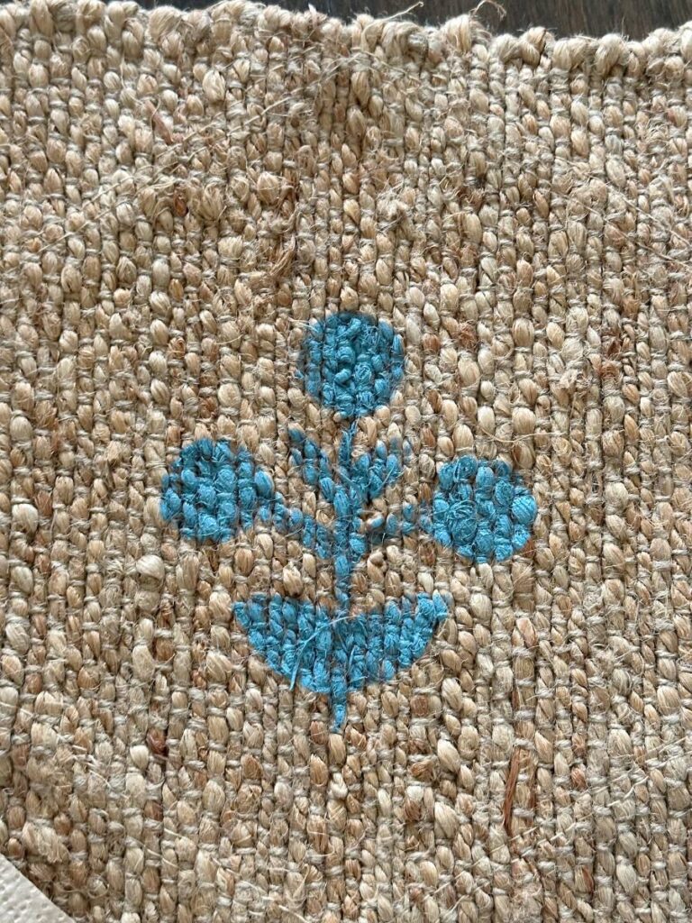 blue block print stencil pattern on jute rug