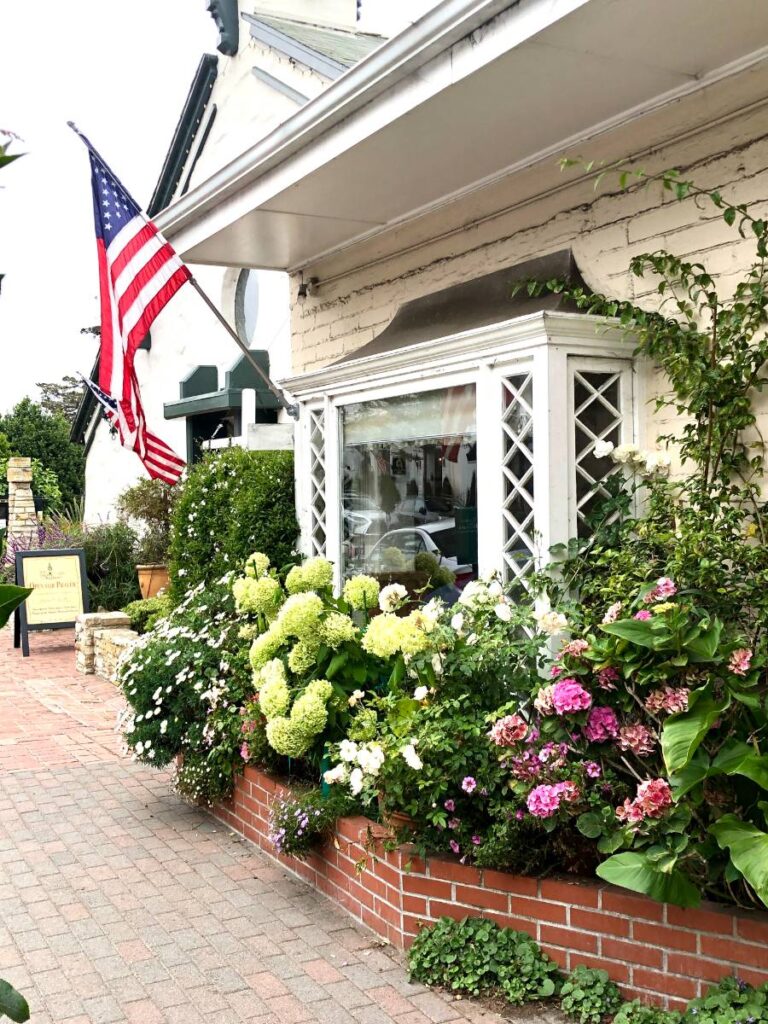 shop with flower boxes in Carmel California