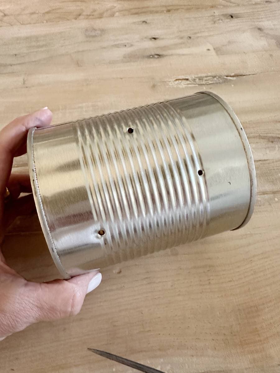 tin can with holes drilled into it