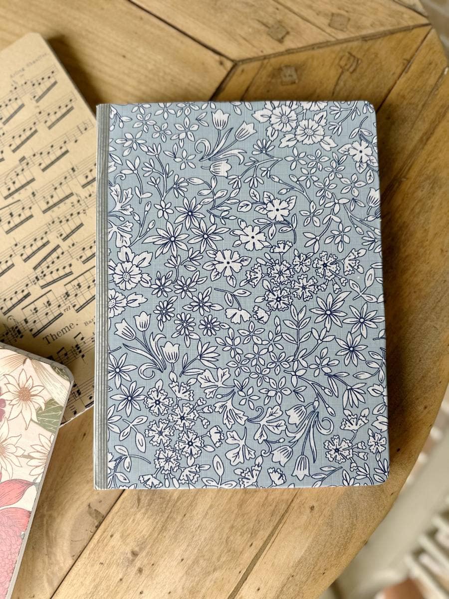 personalized journal covered with blue floral wrapping paper